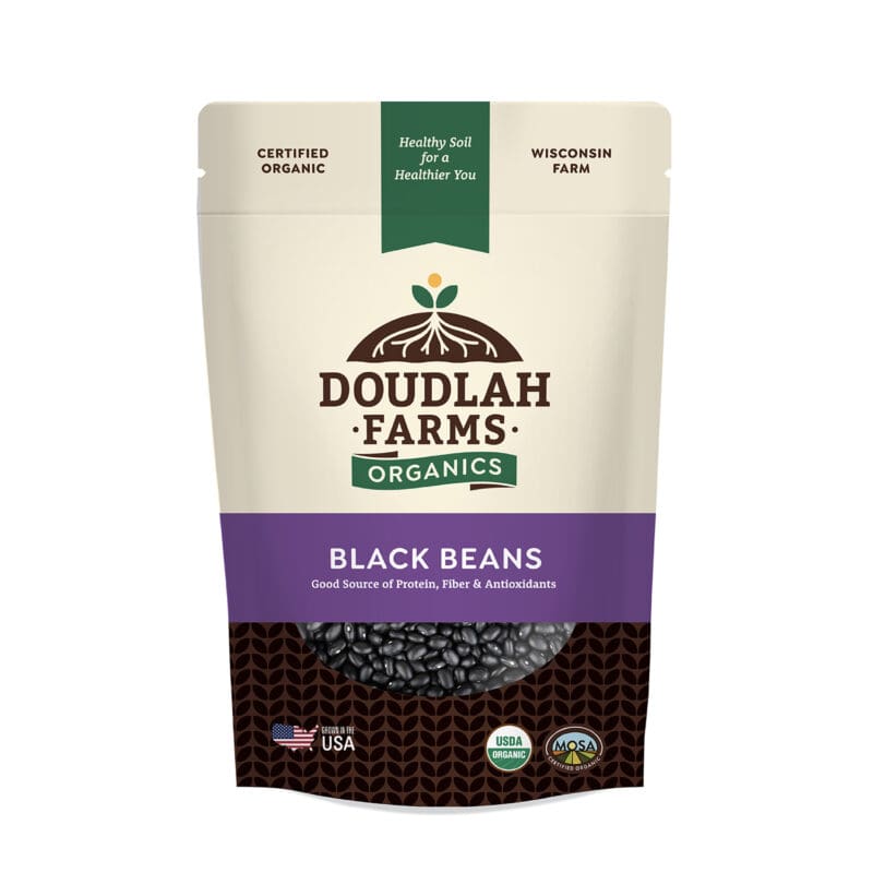 A 1LB package of Doudlah Farms Organics Black Beans. The bag is labeled as certified organic and a good source of protein, fiber, and antioxidants. It proudly displays the USDA organic logo and indicates the product is made in the USA.