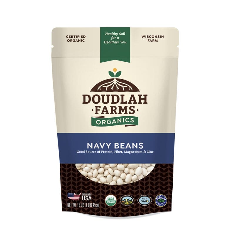 A 1LB package of Doudlah Farms Organics Navy Beans. The bag is labeled as certified organic, non-GMO, and sourced from a Wisconsin farm. It highlights being a good source of protein, fiber, magnesium, and zinc.