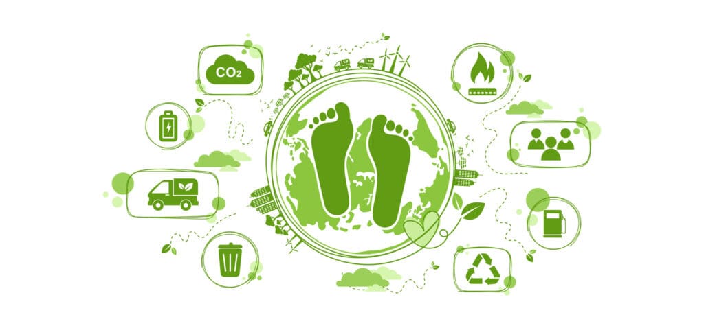 Carbon footprint concept showing green footprints surrounded by sustainable food choices and environmental impact icons that reduce CO2 emissions