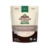 A bag of Emmer Flour from Doudlah Farms Organics displays USDA organic, non-GMO, and Tested Clean certifications, and highlights that it is an ancient grain and a good source of protein.
