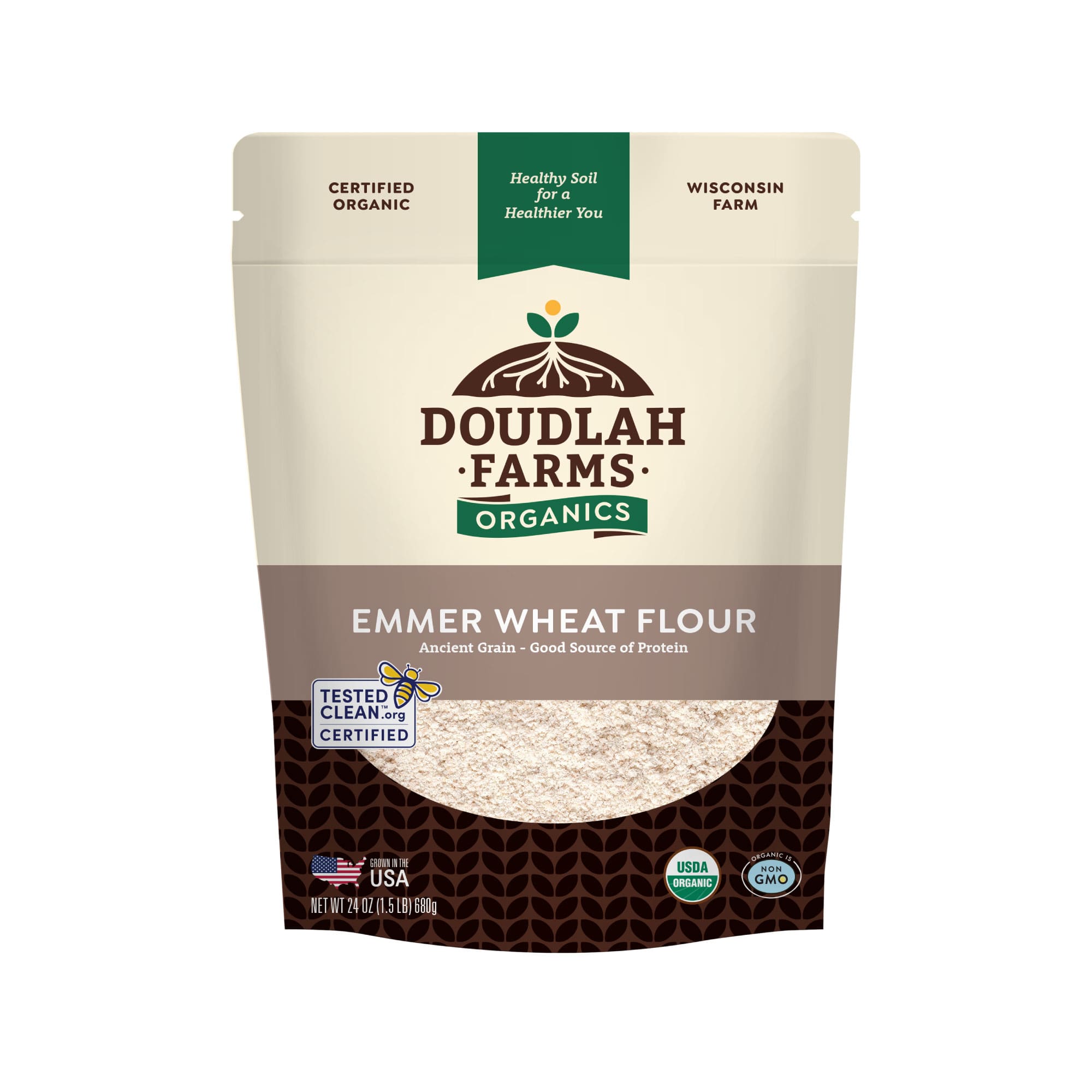 A bag of Emmer Flour from Doudlah Farms Organics displays USDA organic, non-GMO, and Tested Clean certifications, and highlights that it is an ancient grain and a good source of protein.
